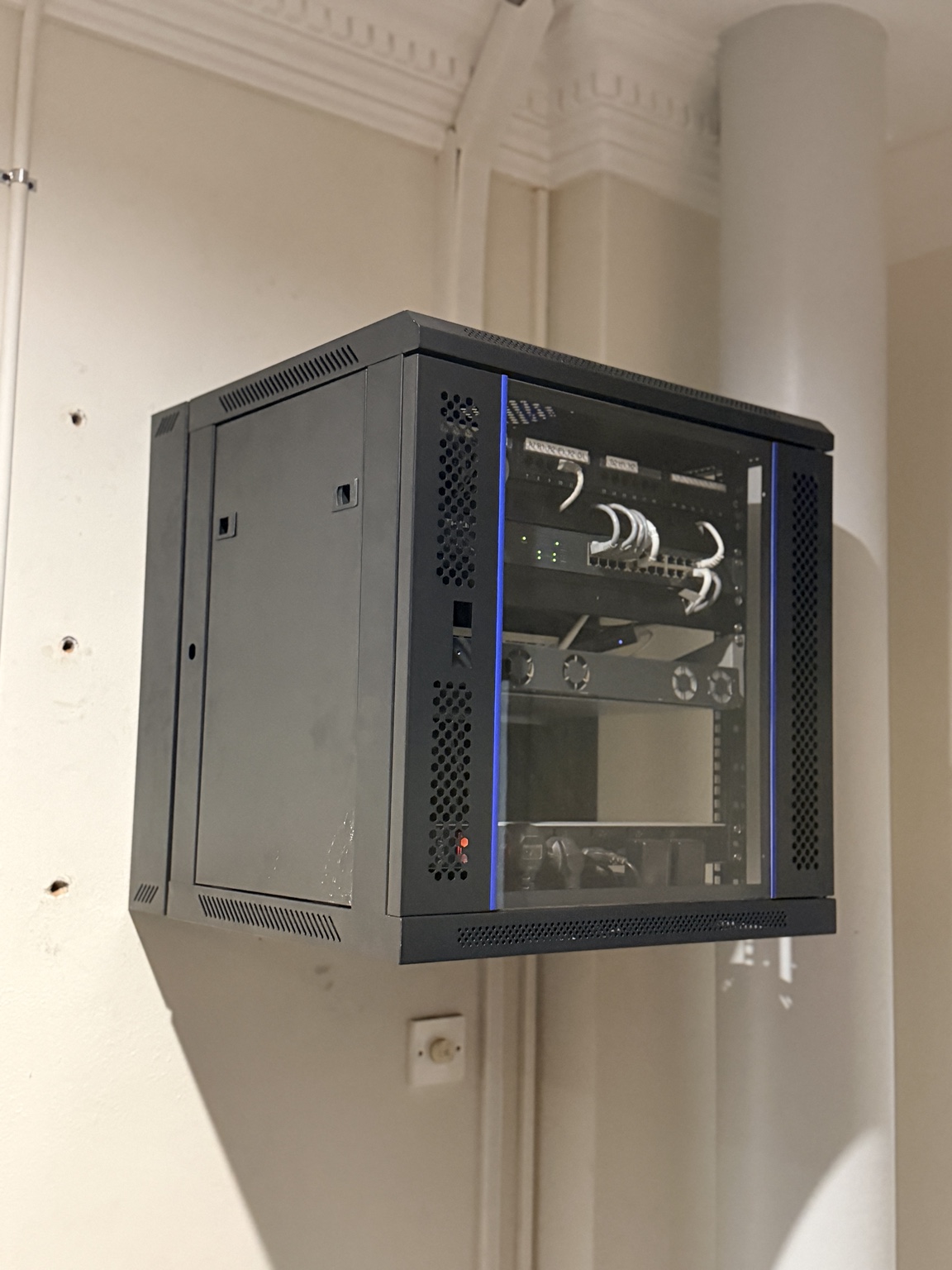 Completed wall-mounted network cabinet installation